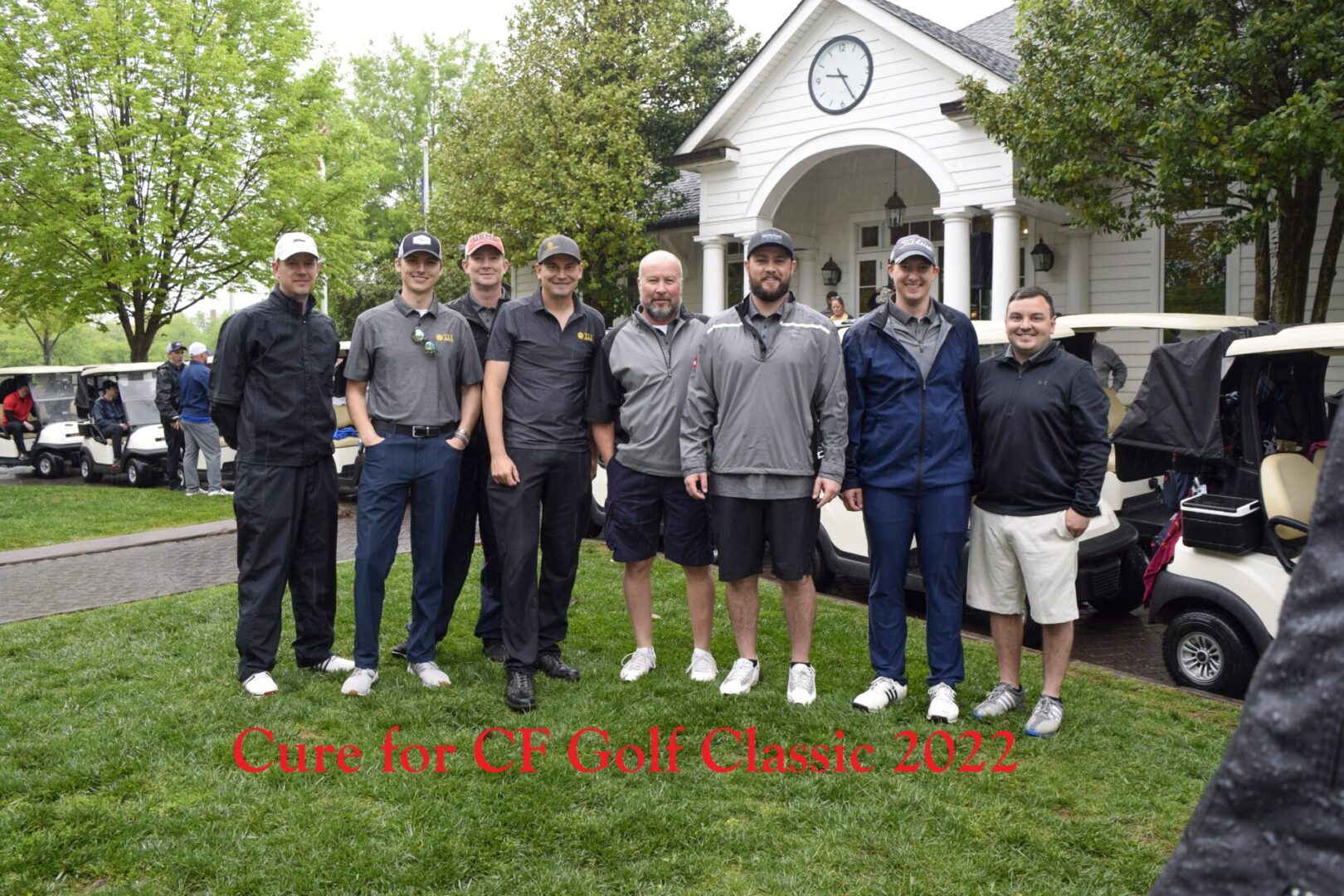 A group of golf enthusiasts standing in front of the camera